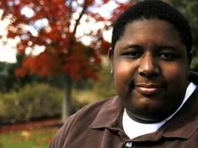 Luther headshot with autumn tree in background