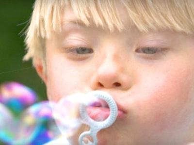 A child blows bubbles